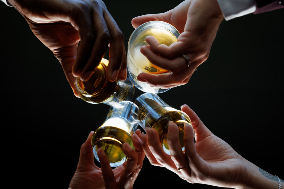 Hand holding a bourbon glass